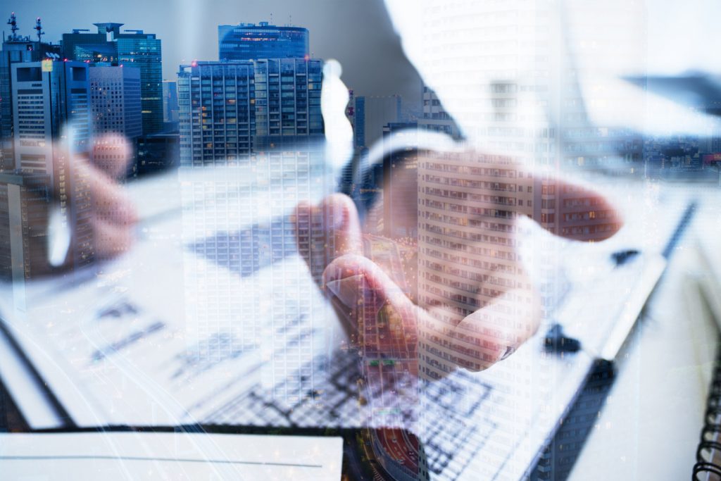 businessman's hand and building