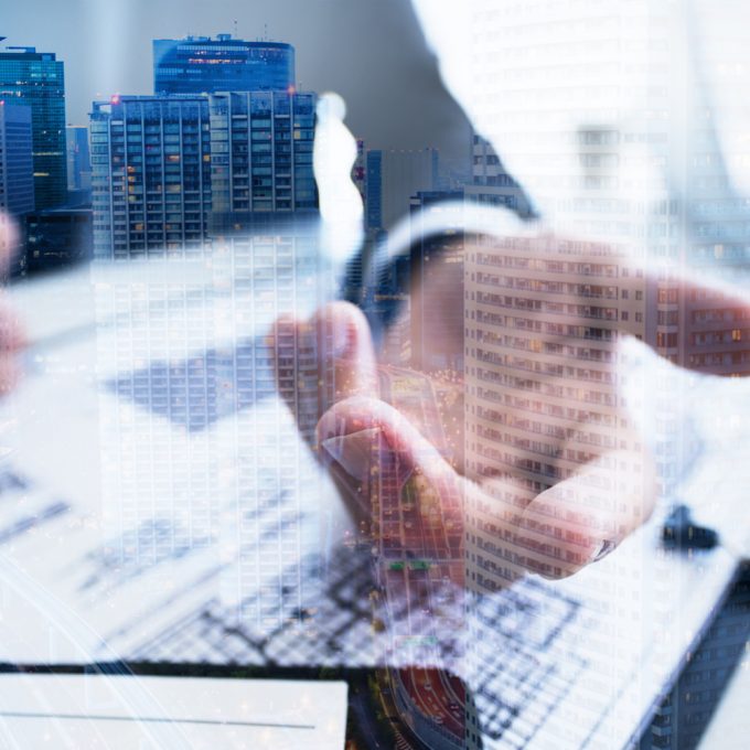 businessman's hand and building